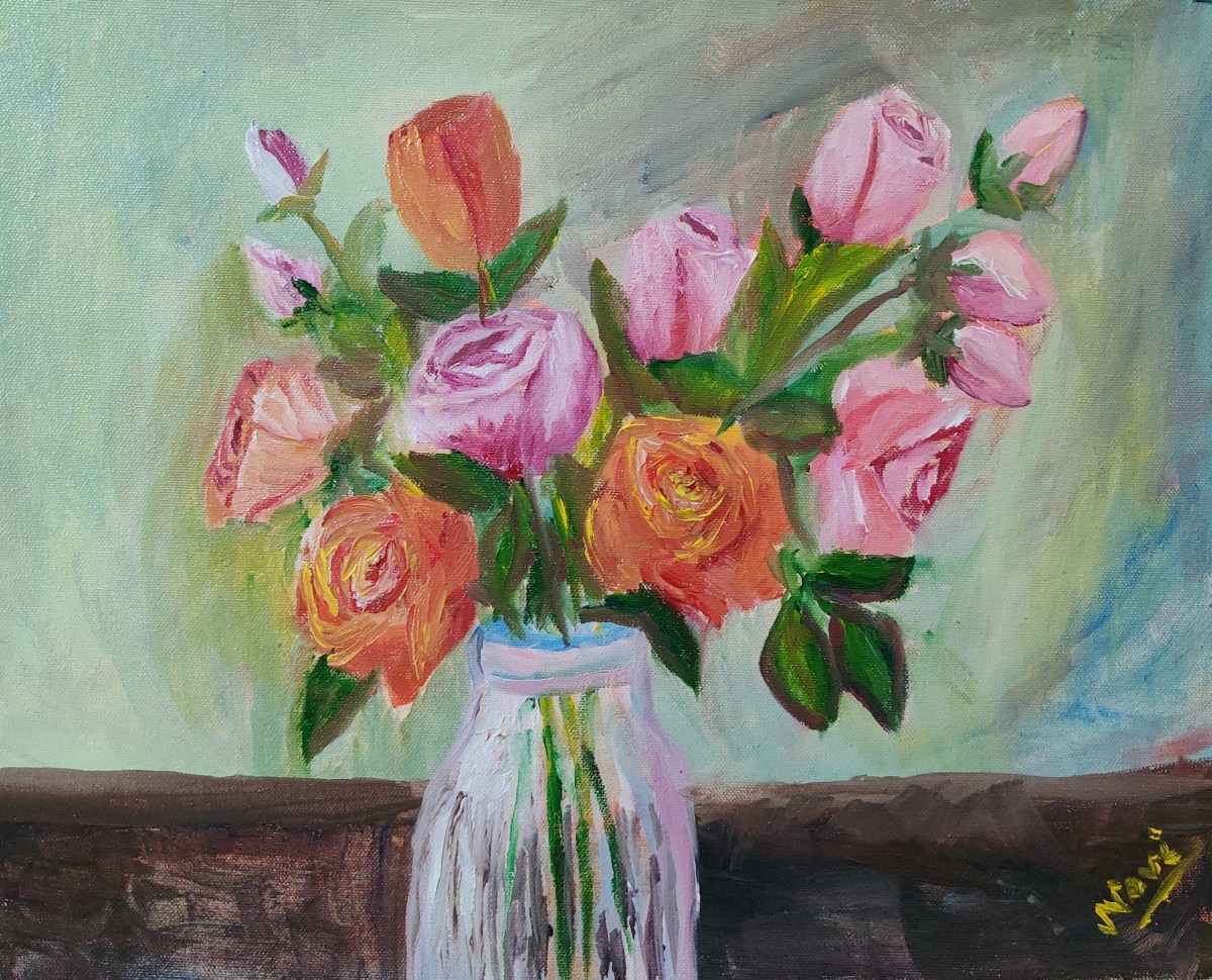 Pink and orange roses in a vase
